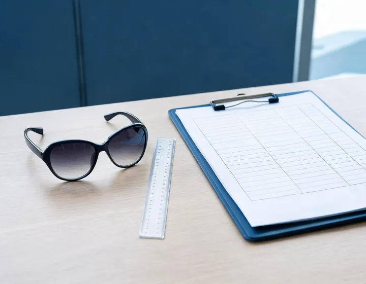 Gradient sunglasses on a buyer briefing desk with millimetre callouts